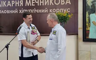 Receiving an award from the hospital director.