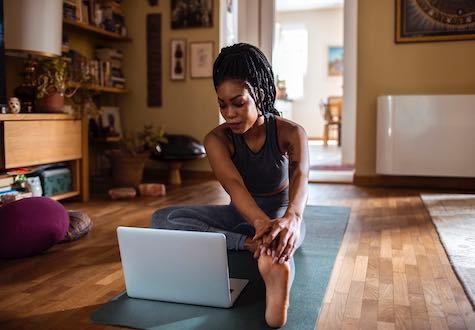 woman doing yoga at home