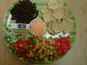 Healthy food for kids doesn't have to be boring. These nachos form a smiley face.