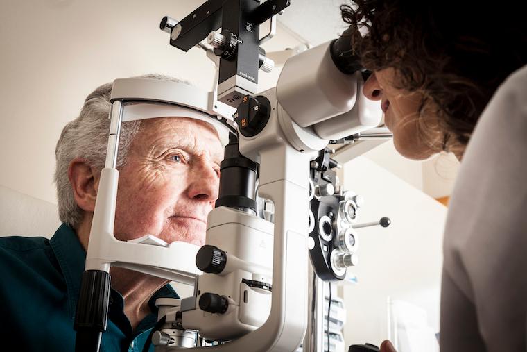 An optometrist conducts an eye exam.