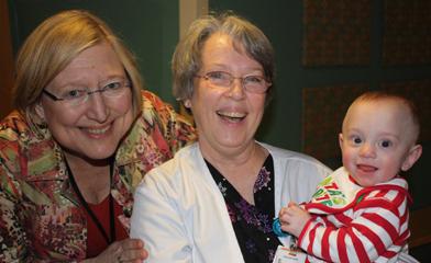 two woman and a baby