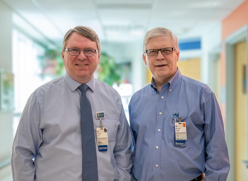 Dr Engel and Dr Lee stand side by side