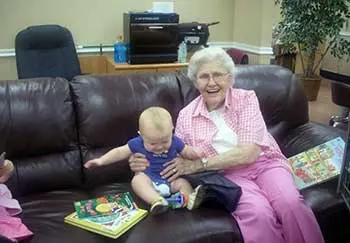 My son making my grandmother smile. Human connection helps with elderly depression.