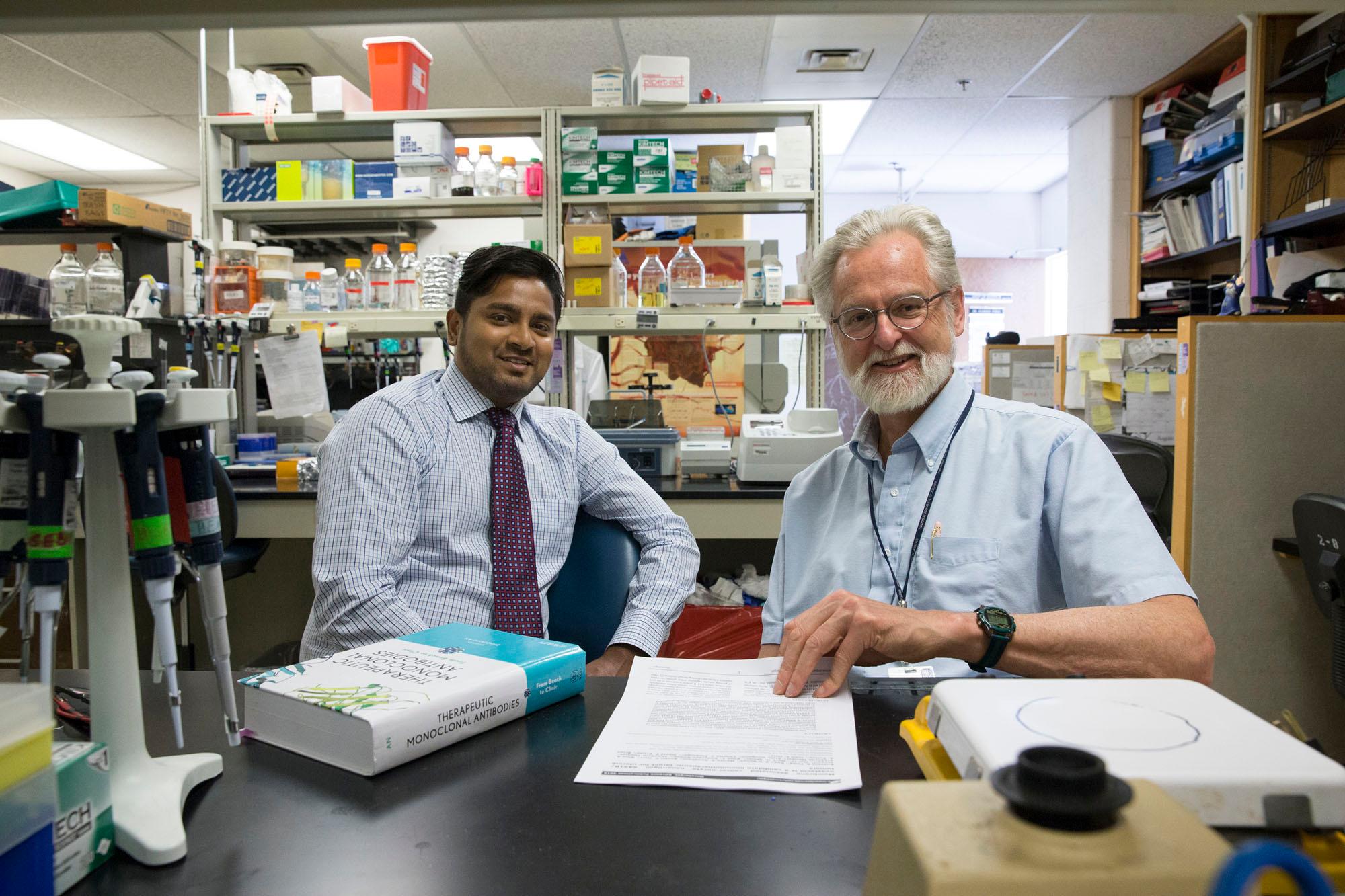 Eusebio Pires, PhD, (left) and John Herr, PhD, have developed a new strategy for attacking cancer cells.