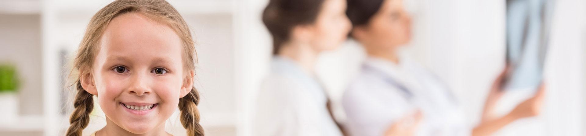 doctors reviewing young girls imaging