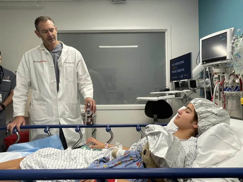 Doctor comes in to talk to Olivia before the surgery