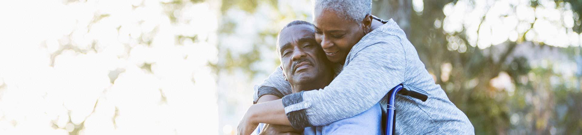 caregiver and patient embracing