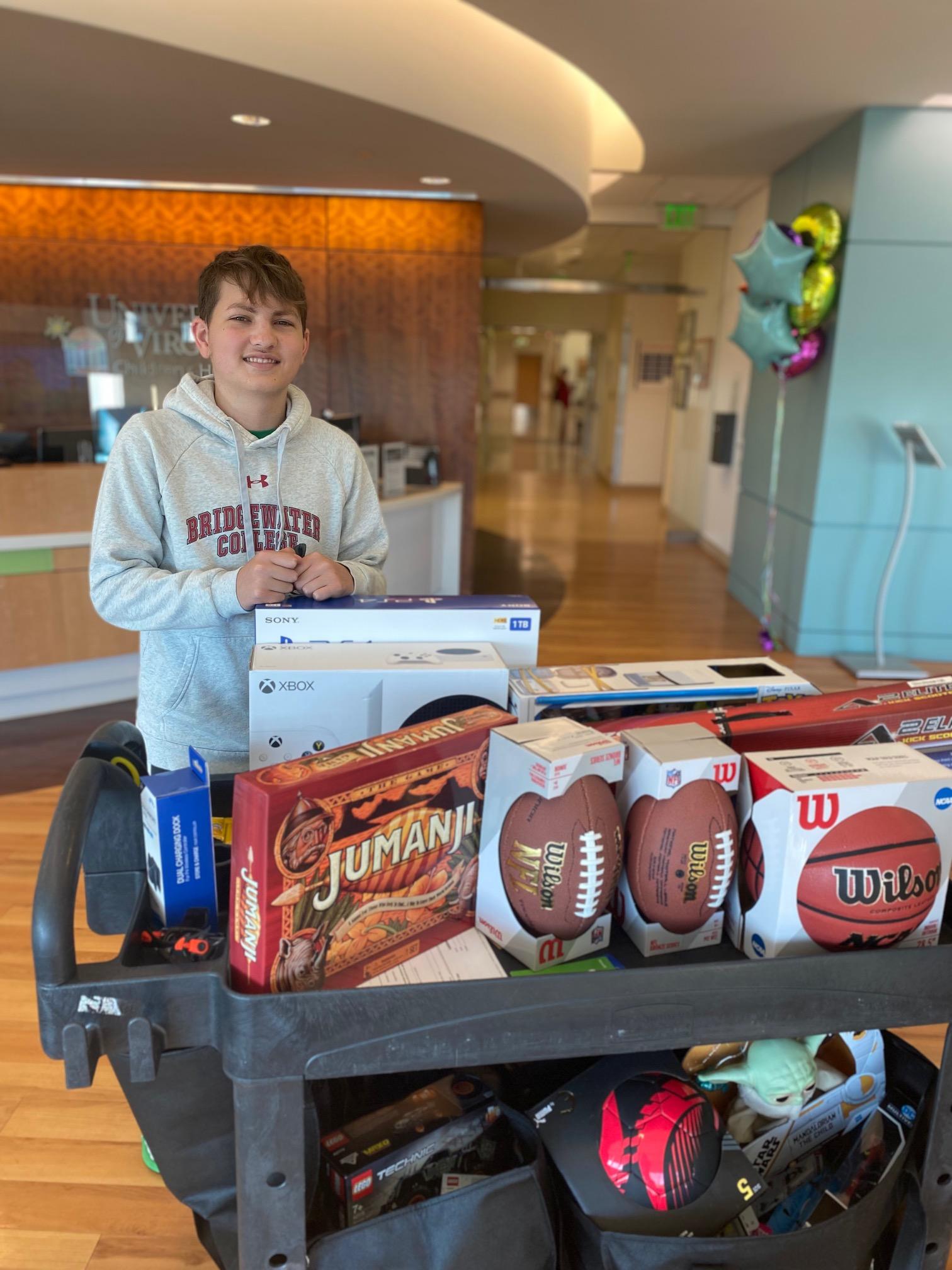 Luke Post poses with items he purchased for the Children's hospital 