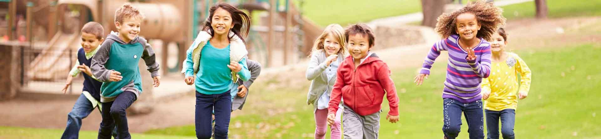 young children running on the playground