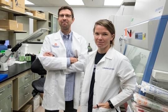 John Lukens, PhD, of UVA's Department of Neuroscience and its Center for Brain Immunology and Glia, in the lab with graduate student Catherine R. Lammert. 