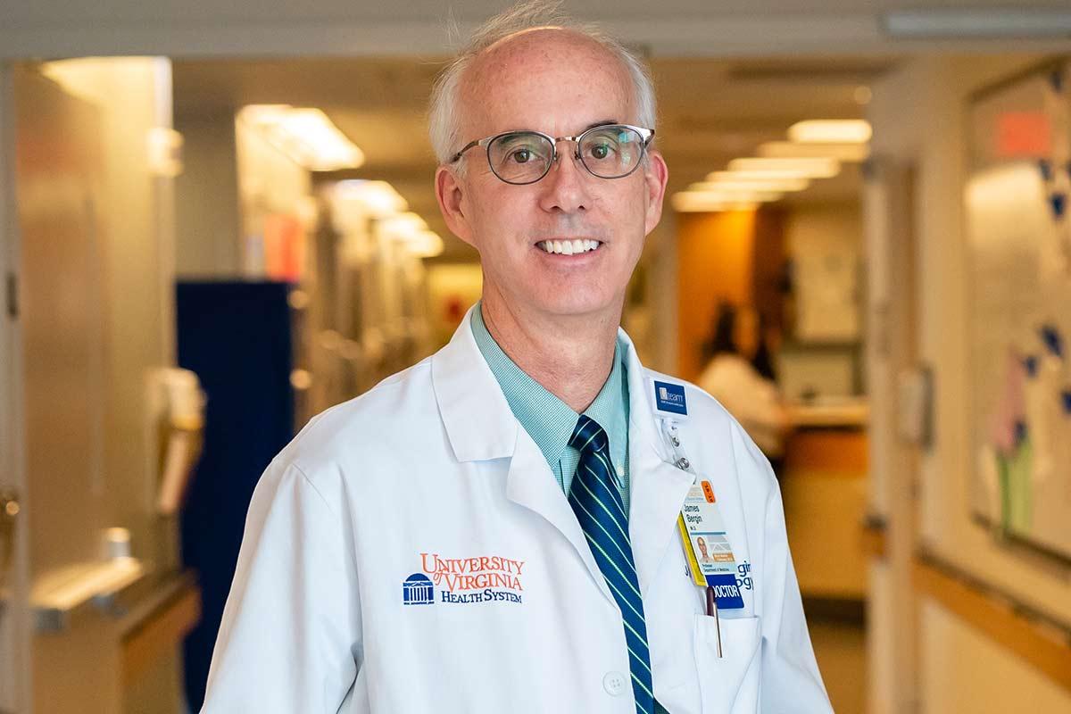 James Bergin, MD smiles in white coat at UVA Health