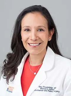Headshot of Elisa Trowbridge in white coat
