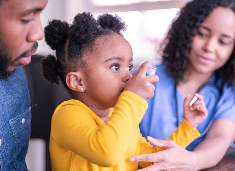 Young girl with inhaler