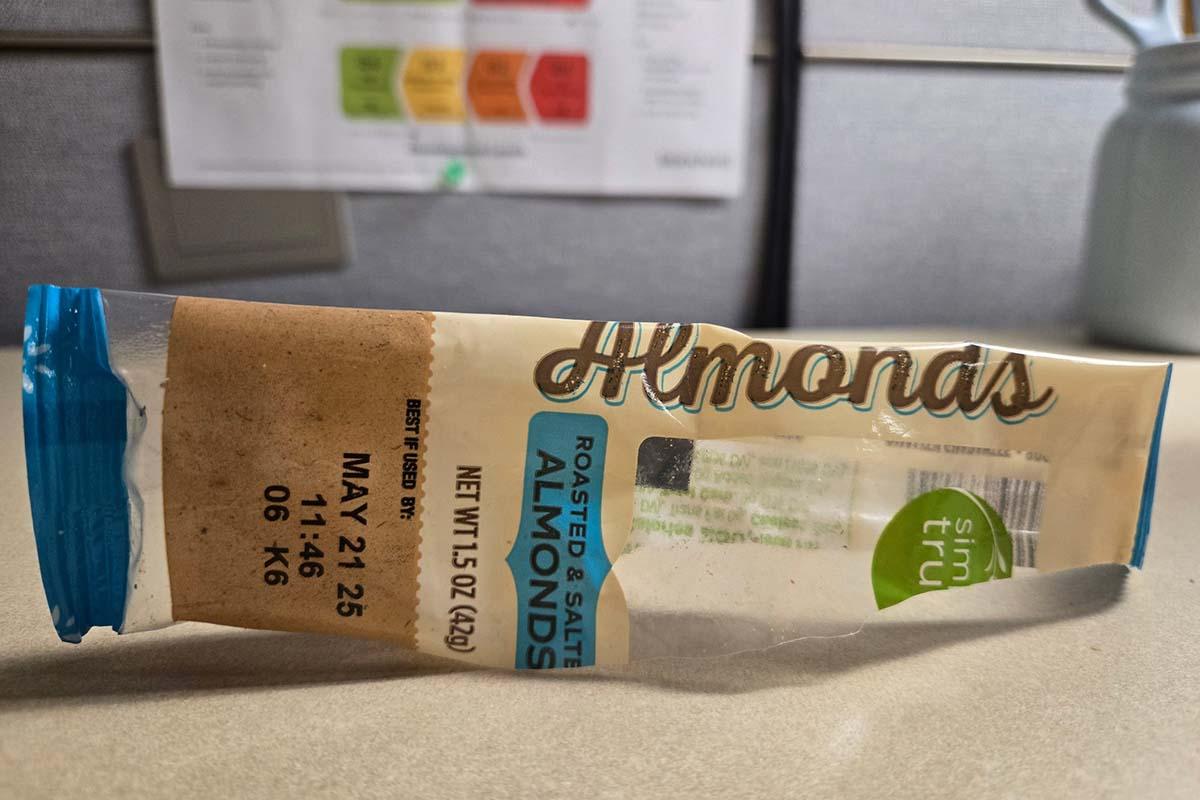 an empty wrapper of a pack of almonds