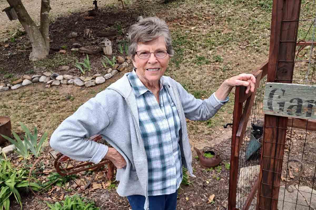 Lorraine in her garden after battling aggressive thyroid cancer