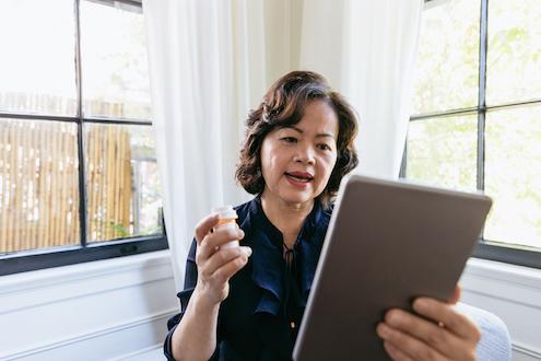 Senior woman participates in a virtual medical appointment