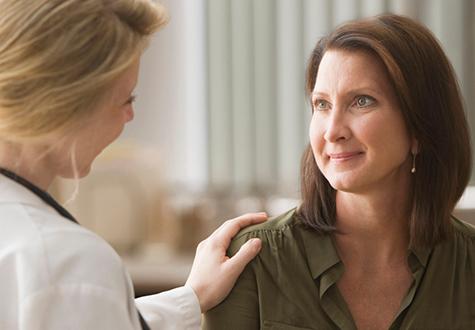 Female doctor talking with patient