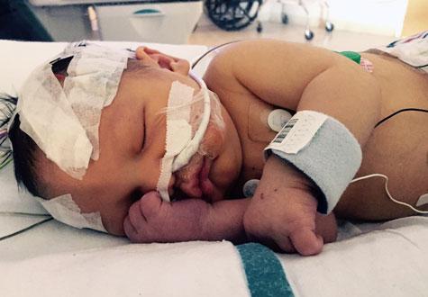 Aiden laying in NICU bed