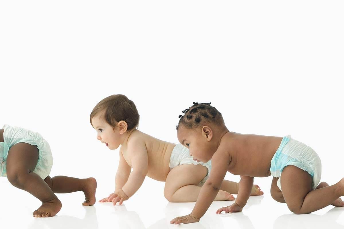 Babies crawling in a baby race
