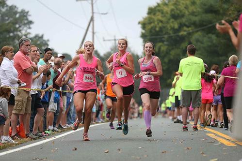 Women running the 4-miler for breast cancer awareness