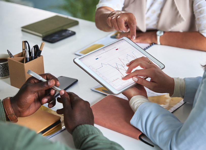 scientists analyze data on a tablet