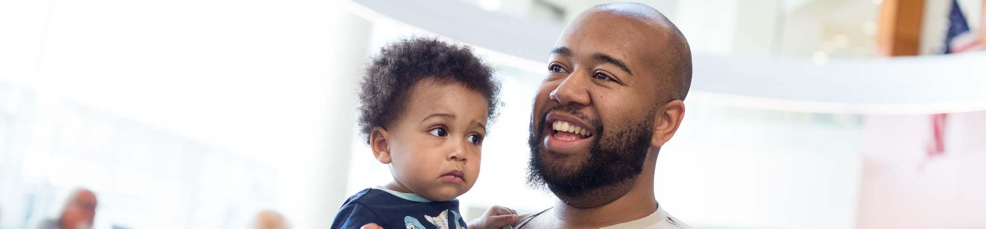 dad and son in lobby of medical center