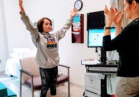 Way shows Josephine how to breathe to ease anxiety.