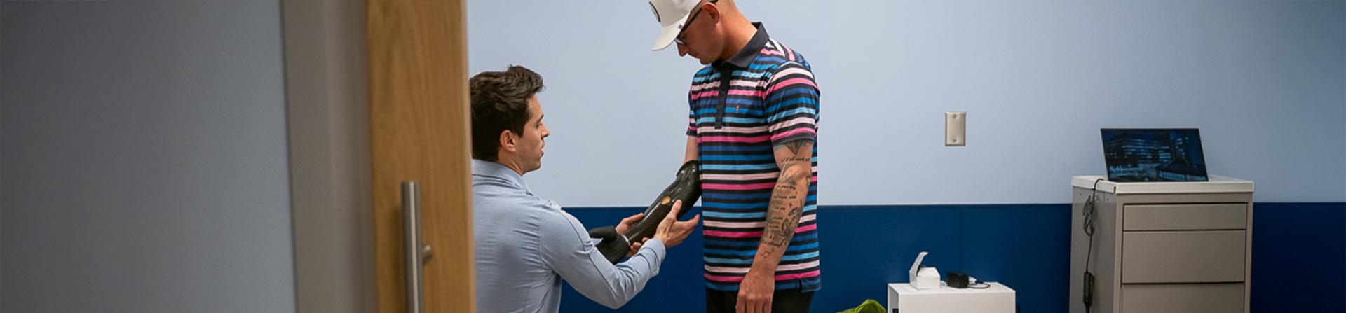 A provide working with a patient with a prosthetic arm
