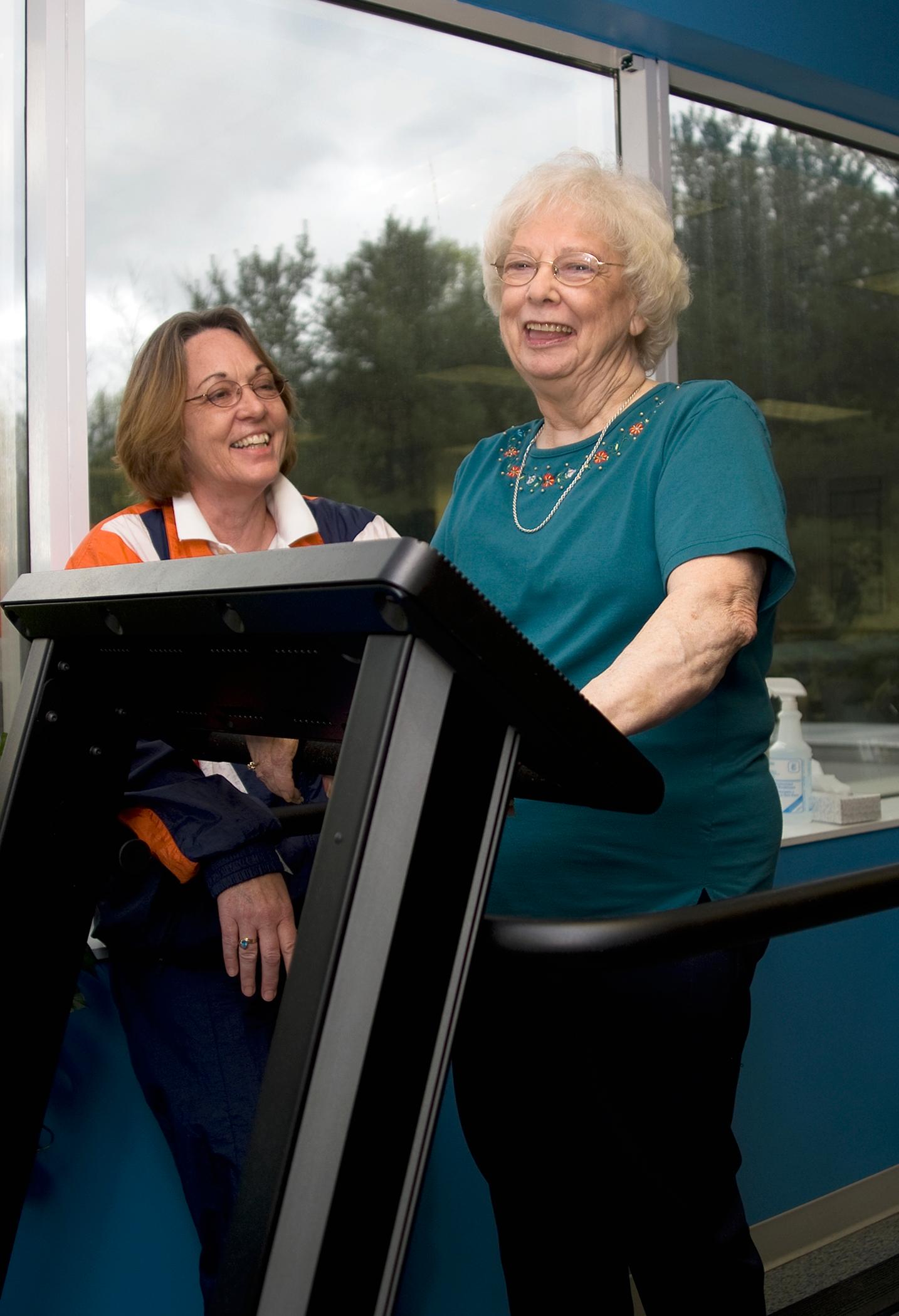 During one of Jackie Guild's appointments, Constance Herring, RN, helped her use the treadmill.