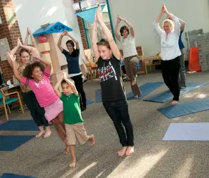 Children take a yoga class at UVA's Kluge Children's Rehabilitation Center