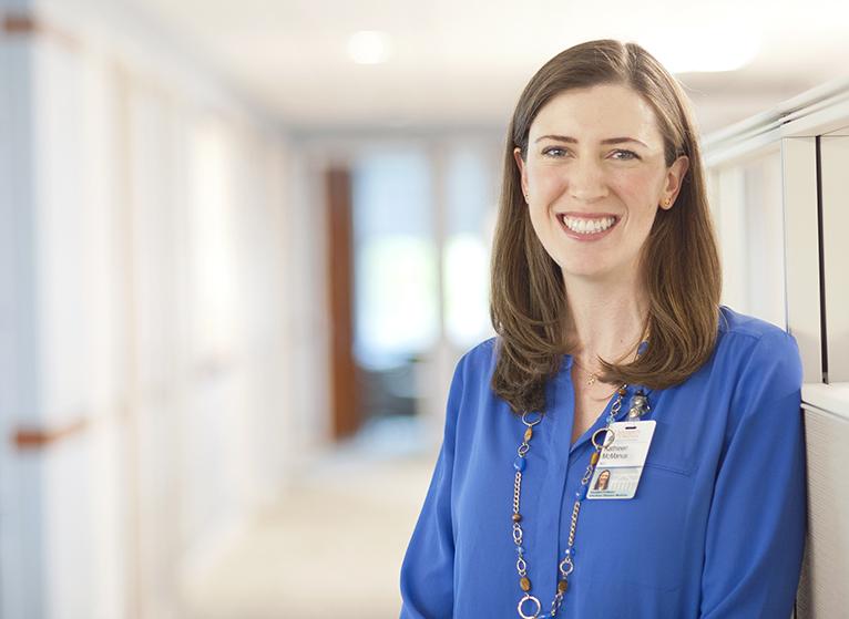 Researcher Kathleen A. McManus is pictured smiling in the medical center 