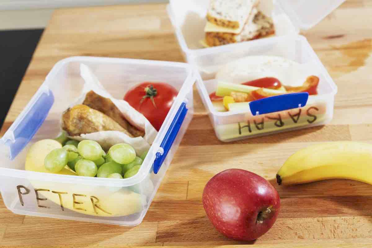 Two healthy school lunches with names printed on sides