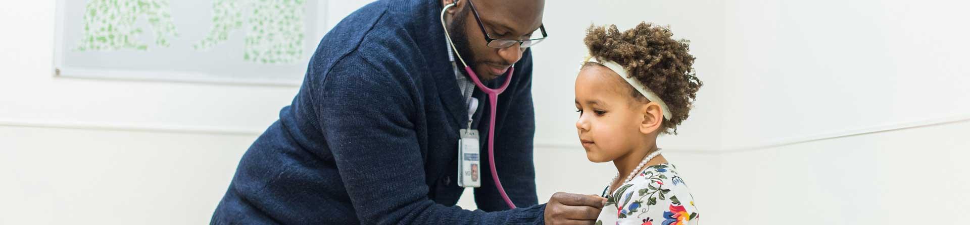 little girl getting a checkup