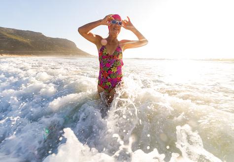 Senior woman going for a morning swim in the sea