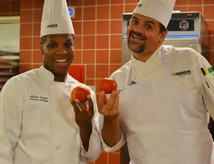 Cafeteria workers show off their wares.