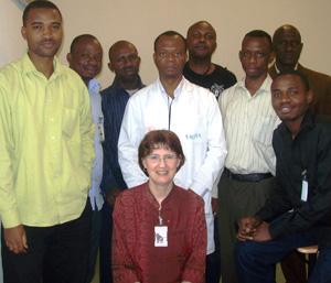 Janine Jagger (front center) with Dr. Pascal Mputu Mputu  (in white coat),director of the Occupational Center for Health Workers  at the Biamba Marie Mutombo Hospital in Kinshasa, and staff who participated in EPINet training