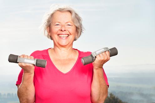 Woman lighting light weights for heart disease prevention