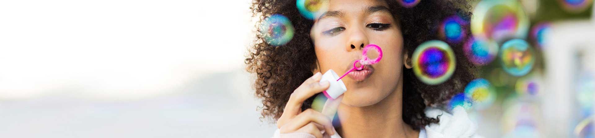 Woman blowing bubbles