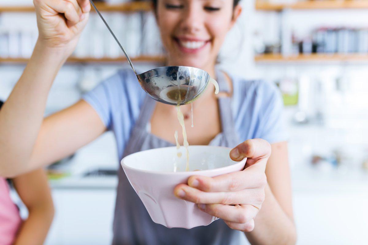 woman enjoying a bowl of her favorite comfort food