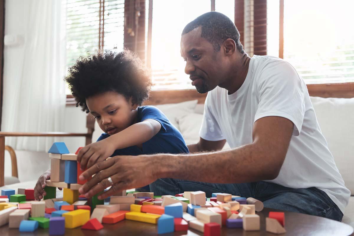 dad and child playing with blocks 