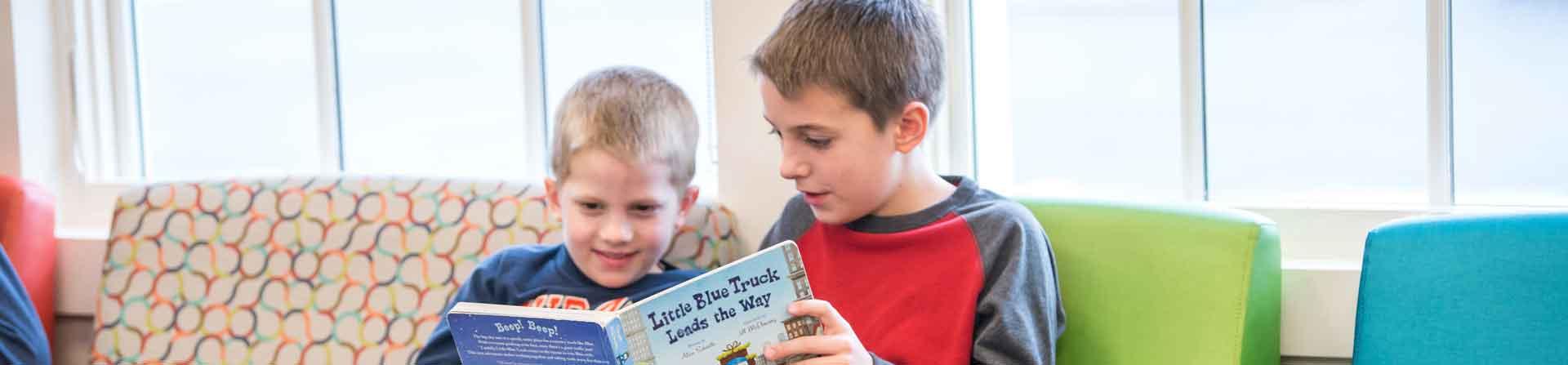 boys reading a book