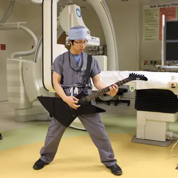 doctors at play: uva neurosurgeon kenneth liu playing guitar 