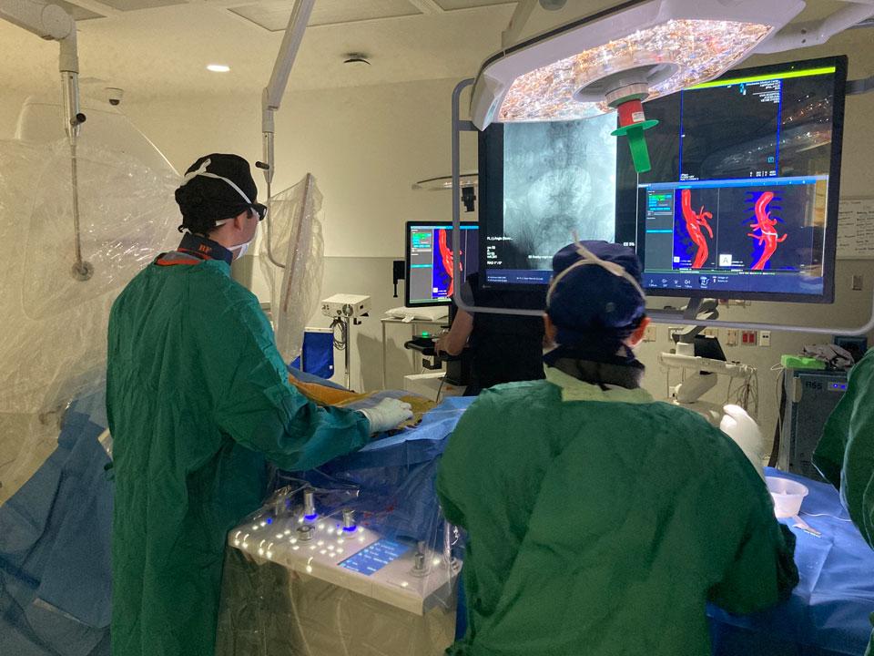 Bezhad Farivar, MD, and a vascular surgery fellow complete a procedure using IOPS imaging guidance.