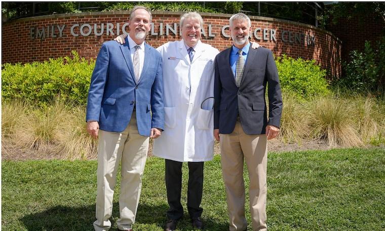 Researchers Charles Chalfant, PhD (from left); Thomas P. Loughran Jr., MD; and David Feith, PhD stand outside the Emily Couric Cancer Center