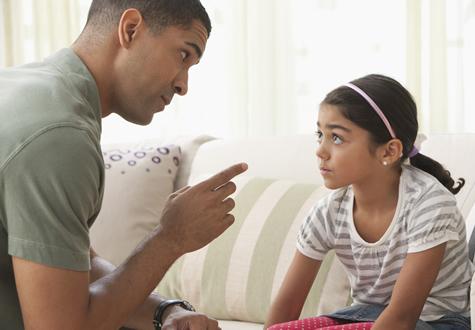 a father disciplines his child