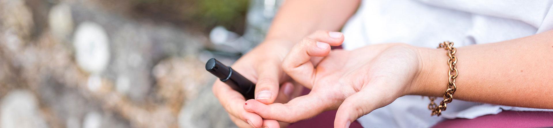 patient pricking finger