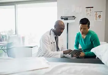 doctor discussing immunotherapy with patient