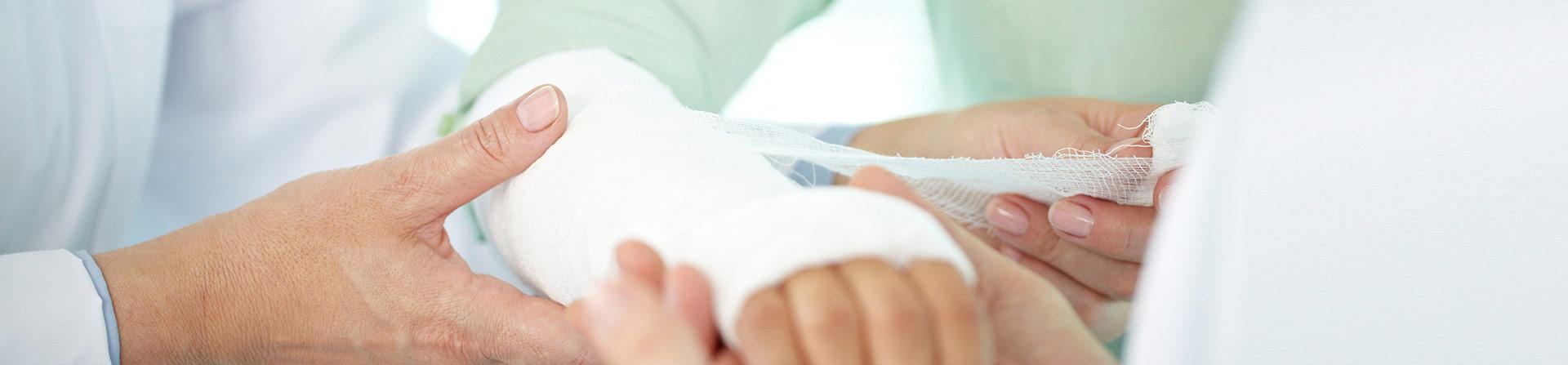 patient holding wrist