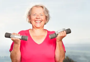 Woman lighting light weights for heart disease prevention
