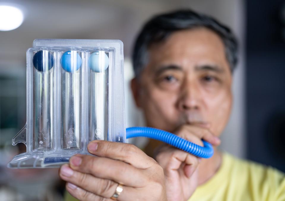 man taking breathing test